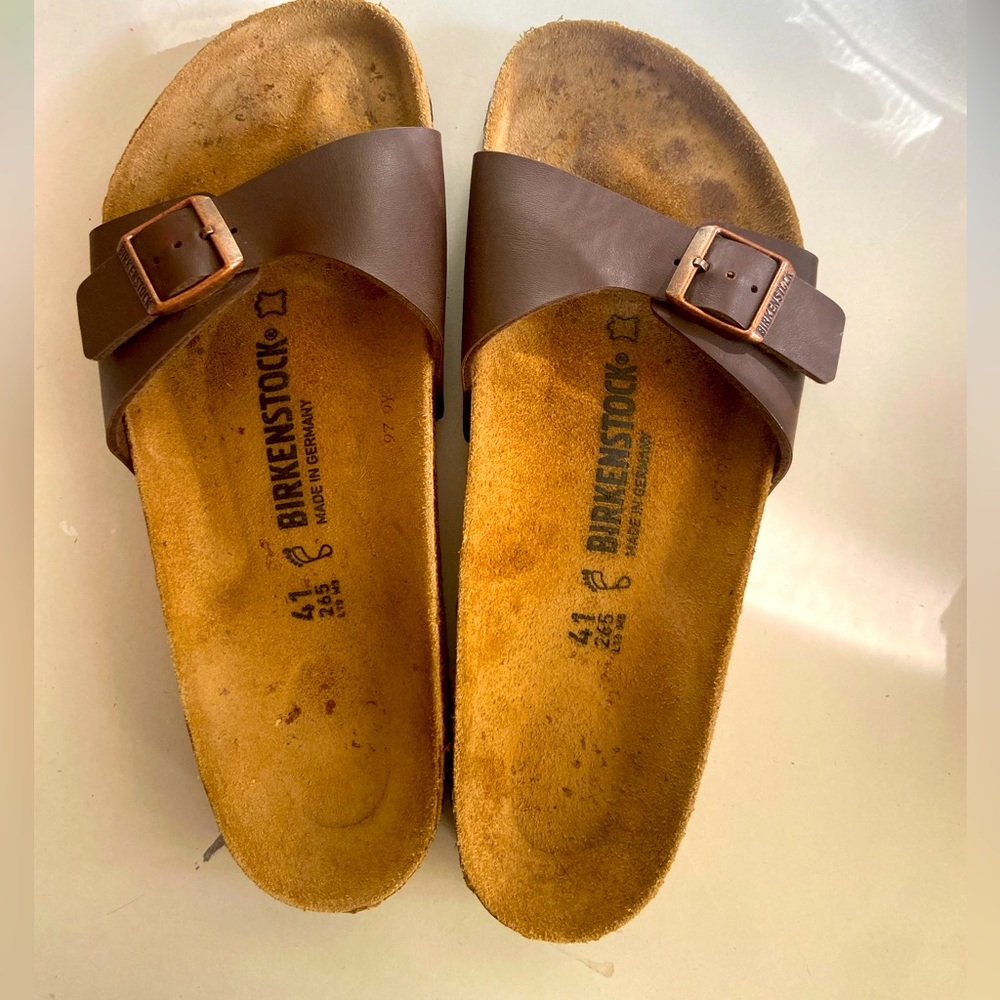 Somewhat worn single strap brown Birkenstocks